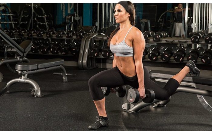 woman performing split squat in a bigger butt workout
